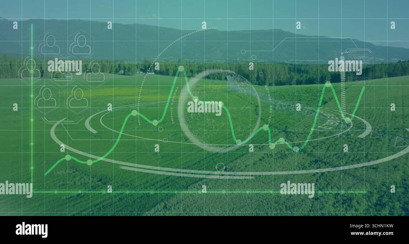 Floating analytics interface over rural farmland, showing line graph, HUD, cube and grid overlay Stock Photo