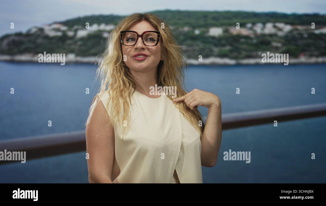 Chest Leaning Against Railing Blonde woman wearing glasses and cream blouse with hand on chest ...