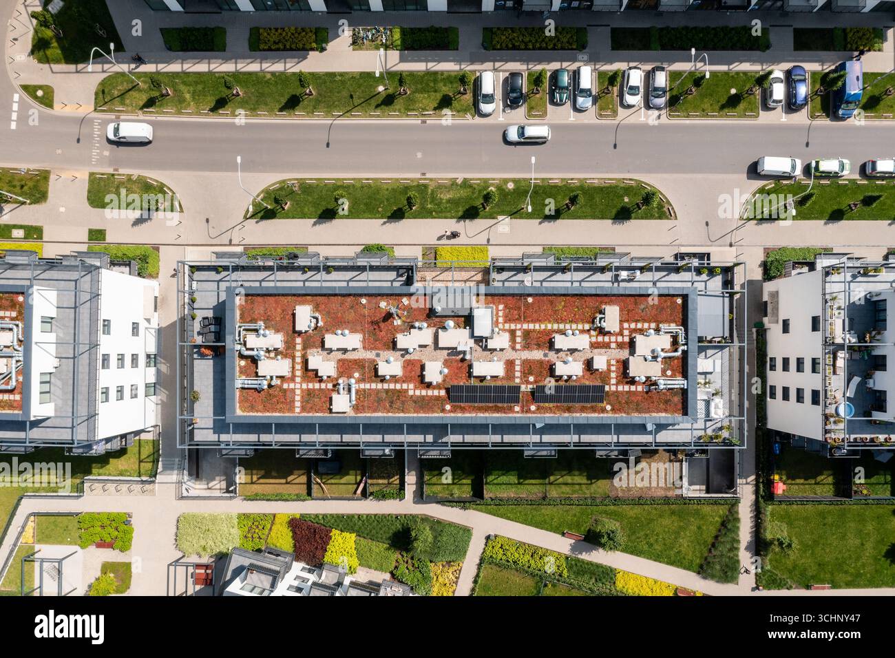 View of Aerial top-down view of modern apartment building with green rooftop ...
