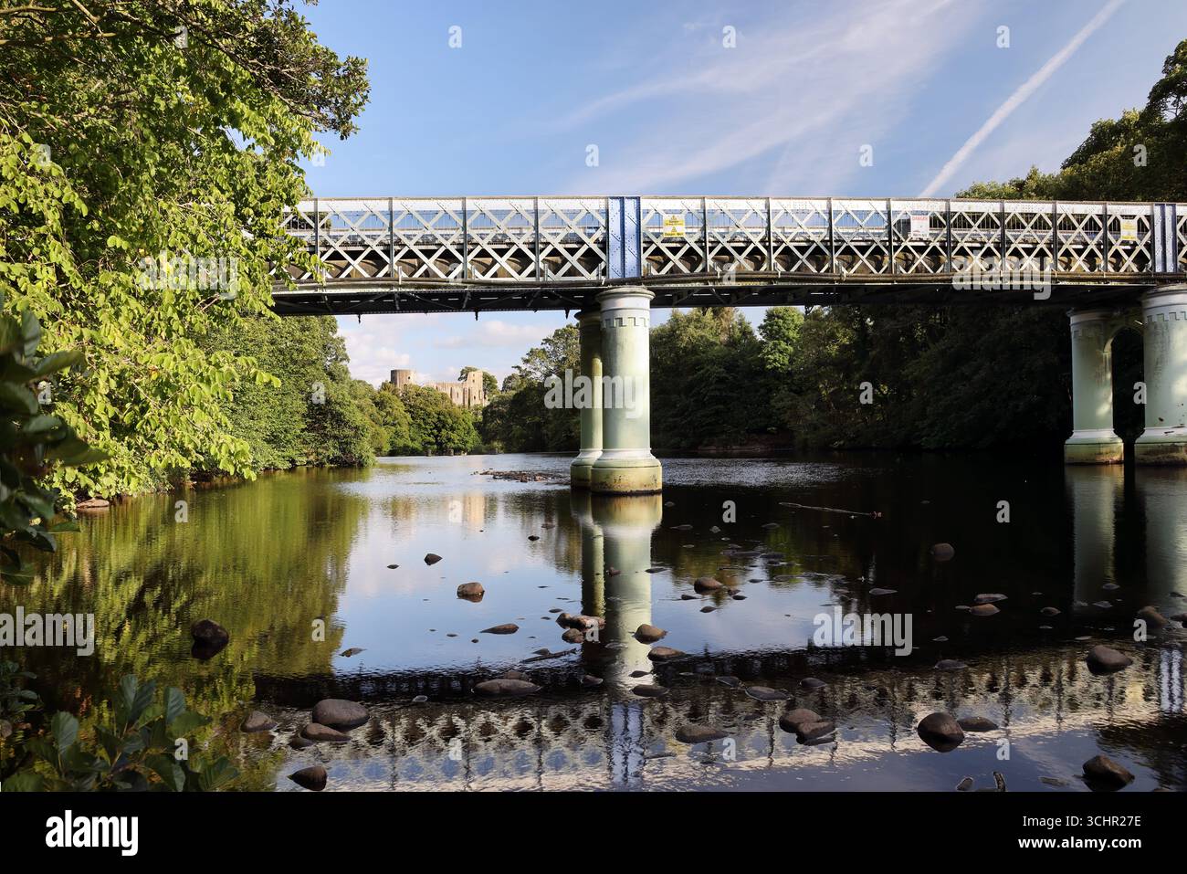 The Deepdale aqueduct bridge with the medieval Castle of Barnard Castle beyond, Teesdale, County Durham, UK Stock Photo