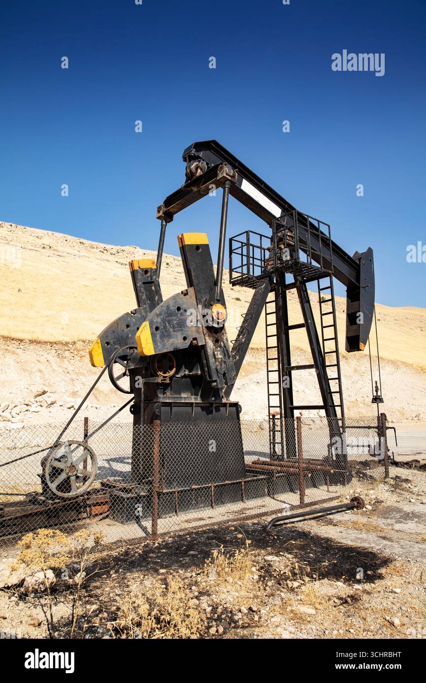 Oil Derricks Oil drilling derricks at desert oilfield. Crude oil production from the ...