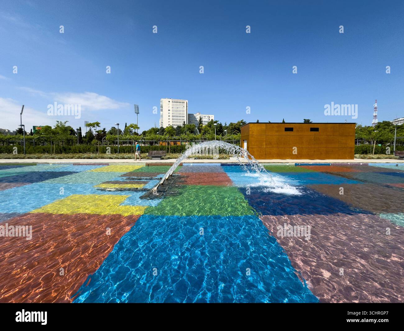 Polychrome Pond: A pond with a colorful tiled base, surrounded by a series of fountains. Tercer Depósito Park, Parque. Chamberi, Madrid - Smartphone Captured Stock Image
