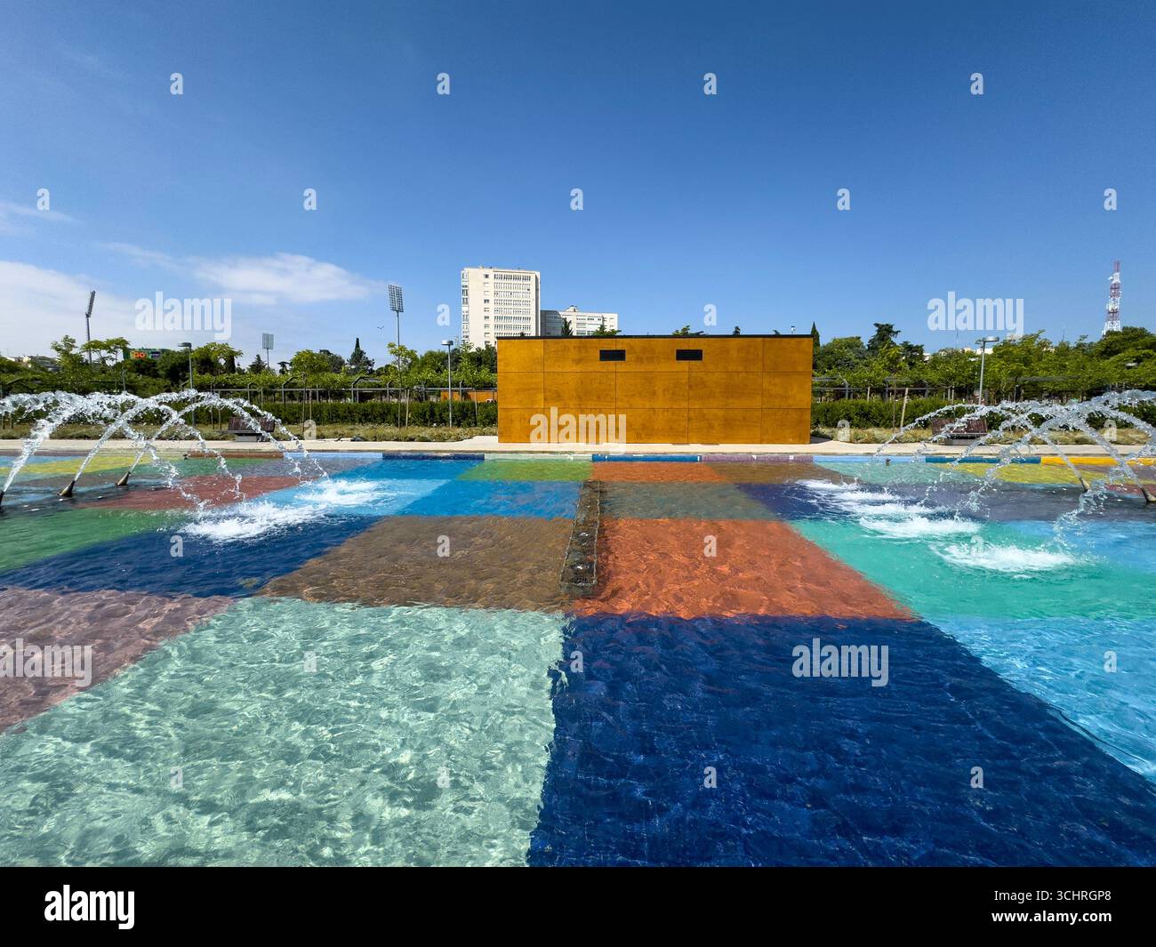 Polychrome Pond: A pond with a colorful tiled base, surrounded by a series of fountains. Tercer Depósito Park, Parque. Chamberi, Madrid - Smartphone Captured Stock Image