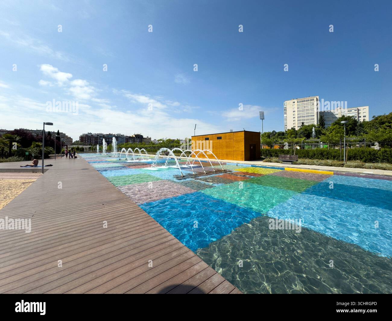 Polychrome Pond: A pond with a colorful tiled base, surrounded by a series of fountains. Tercer Depósito Park, Parque. Chamberi, Madrid - Smartphone Captured Stock Image