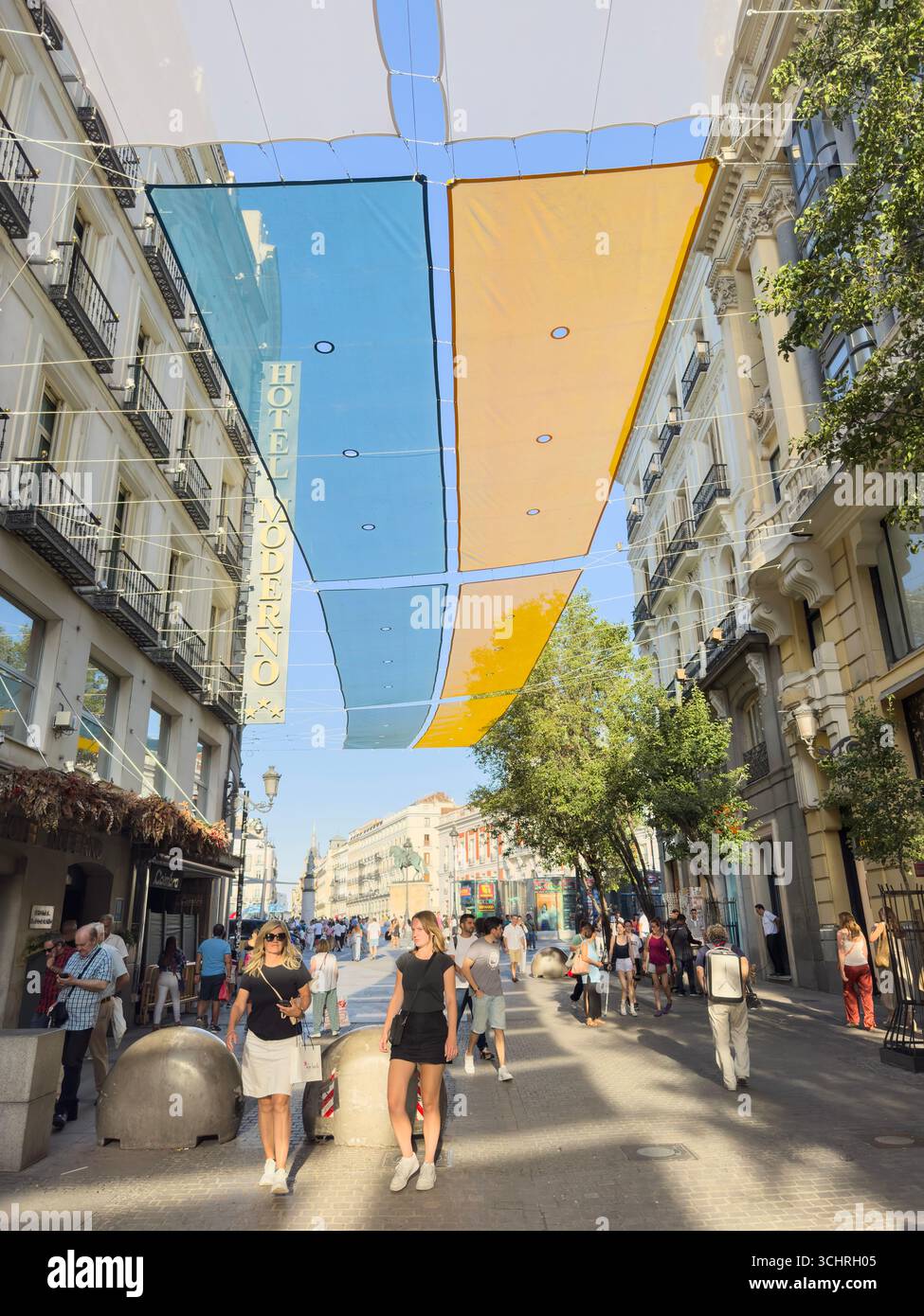 Shades against the heat in Calle del Arenal, Madrid, Spain - Smartphone Captured Stock Image