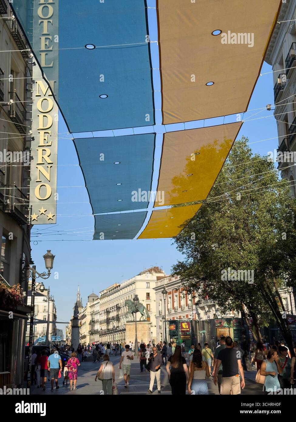 Shades against the heat in Calle del Arenal, Madrid, Spain - Smartphone Captured Stock Image