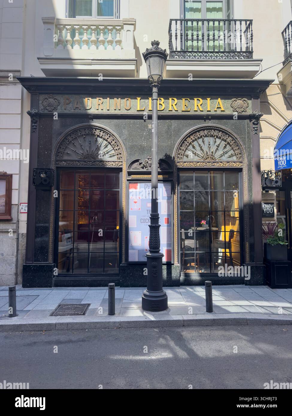 Padrino libreria, Calle Barquillo is a historic street in Madrid’s Justicia neighborhood, within the Centro district. Spain - Smartphone Captured Stock Image