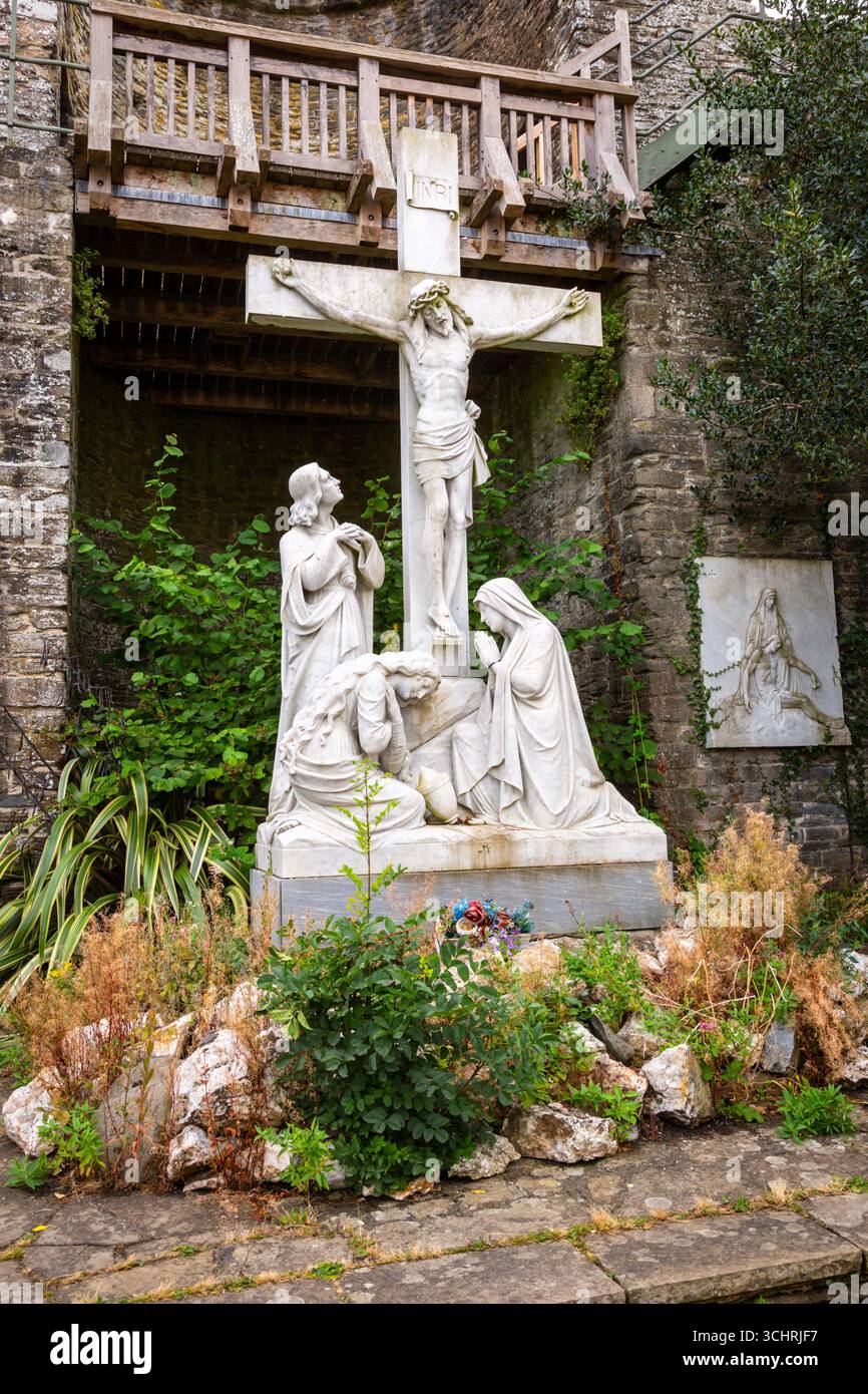 Lifesize statue of Christ on the cross with attendants, UK. 2025 Stock Photo