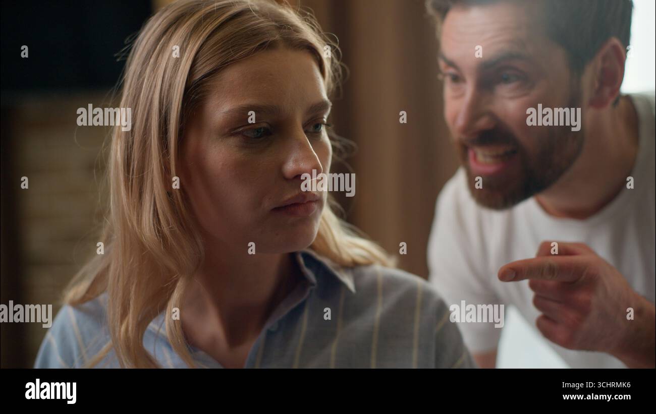 Family stressed Caucasian couple arguing divorce in bedroom morning partners relationship problem mad furious man screaming husband yell conflict Stock Photo