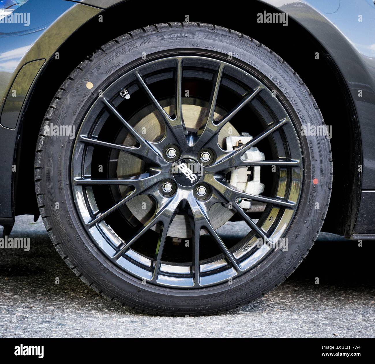 Close-up photo of the wheel on a Mazda MX5 Miata. Stock Photo