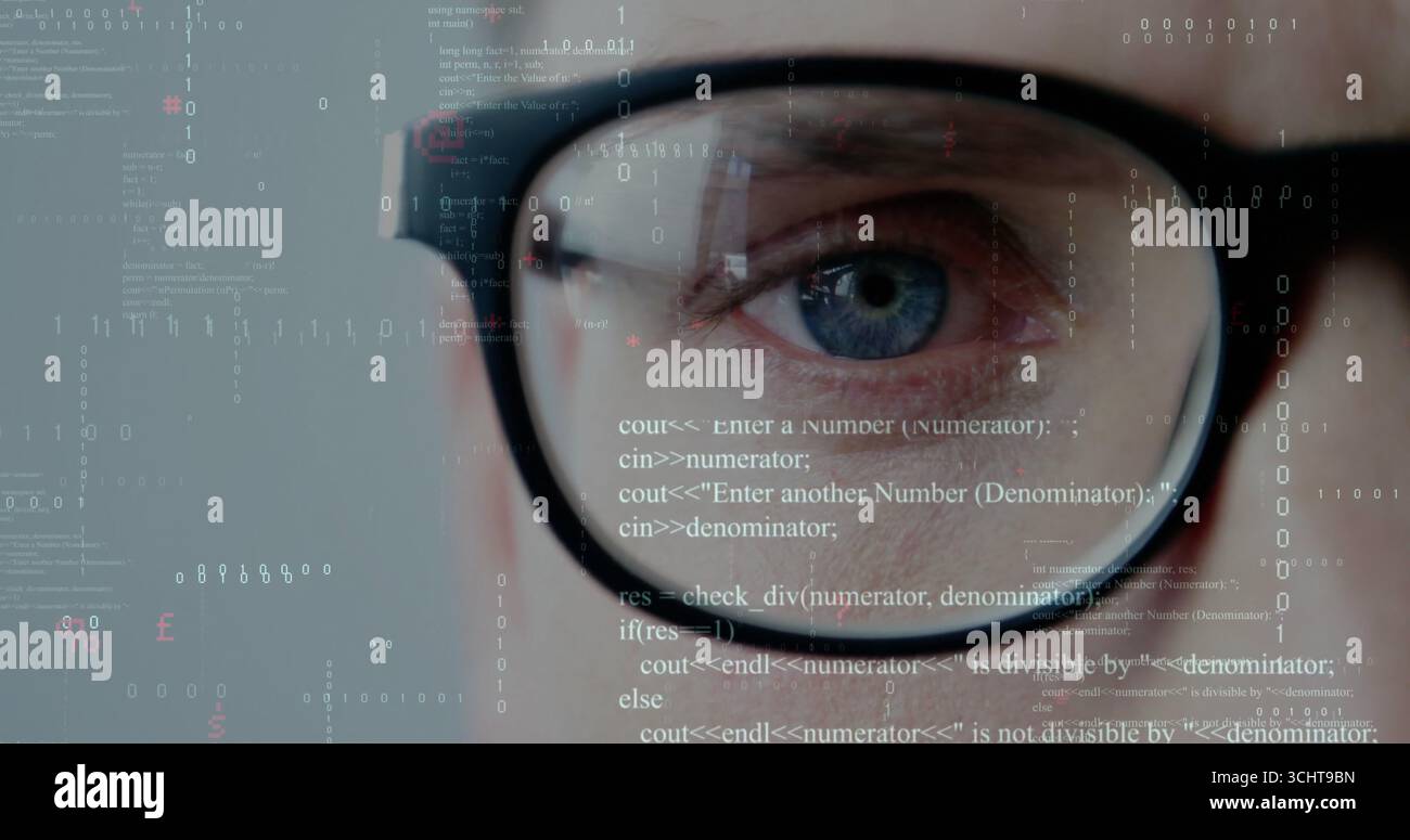 Focusing developer's eye behind black-rimmed glasses at digital interface with code and binary bits Stock Photo