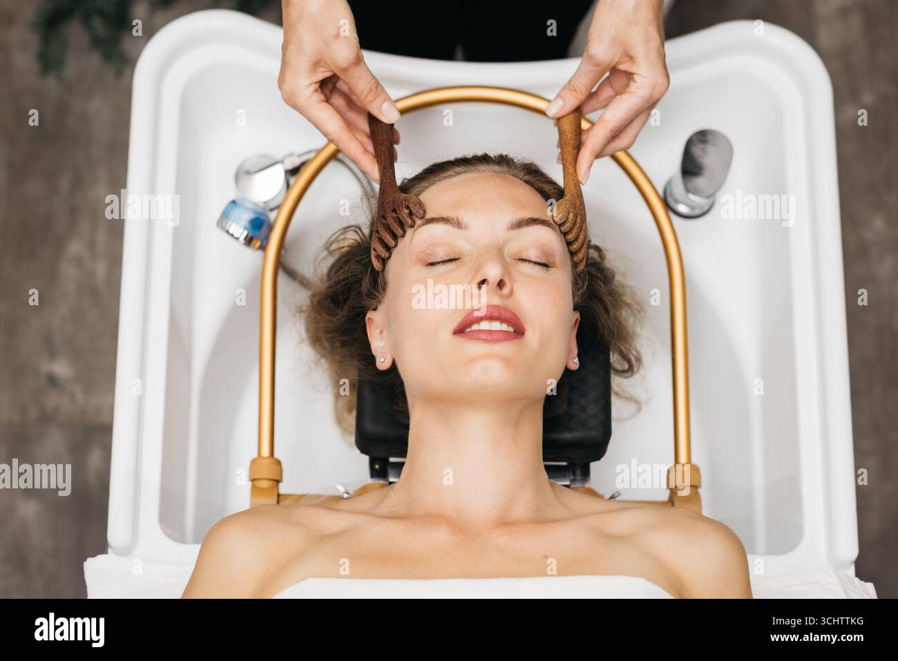 Female model enjoys a rejuvenating facial massage in a tranquil spa ...
