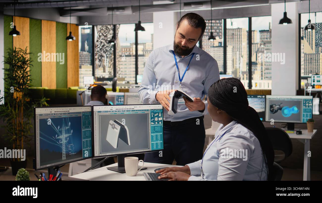 Team of engineers brainstorm upgrades for innovative solar powered device prototype. Research and development office coworkers do trial of portable solar panel gadget to improve efficiency, camera A Stock Photo