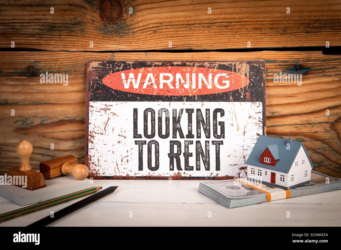 Warning Sign Property Risk Warning sign and miniature house illustrating rental housing risk ...
