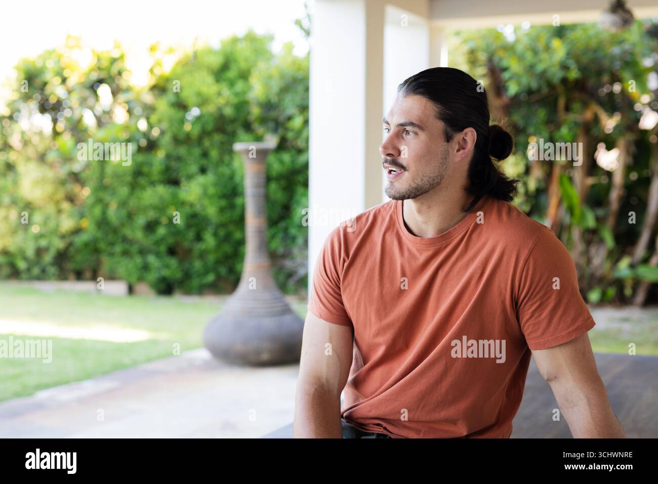 Person in orange shirt hi-res stock photography and images - Alamy