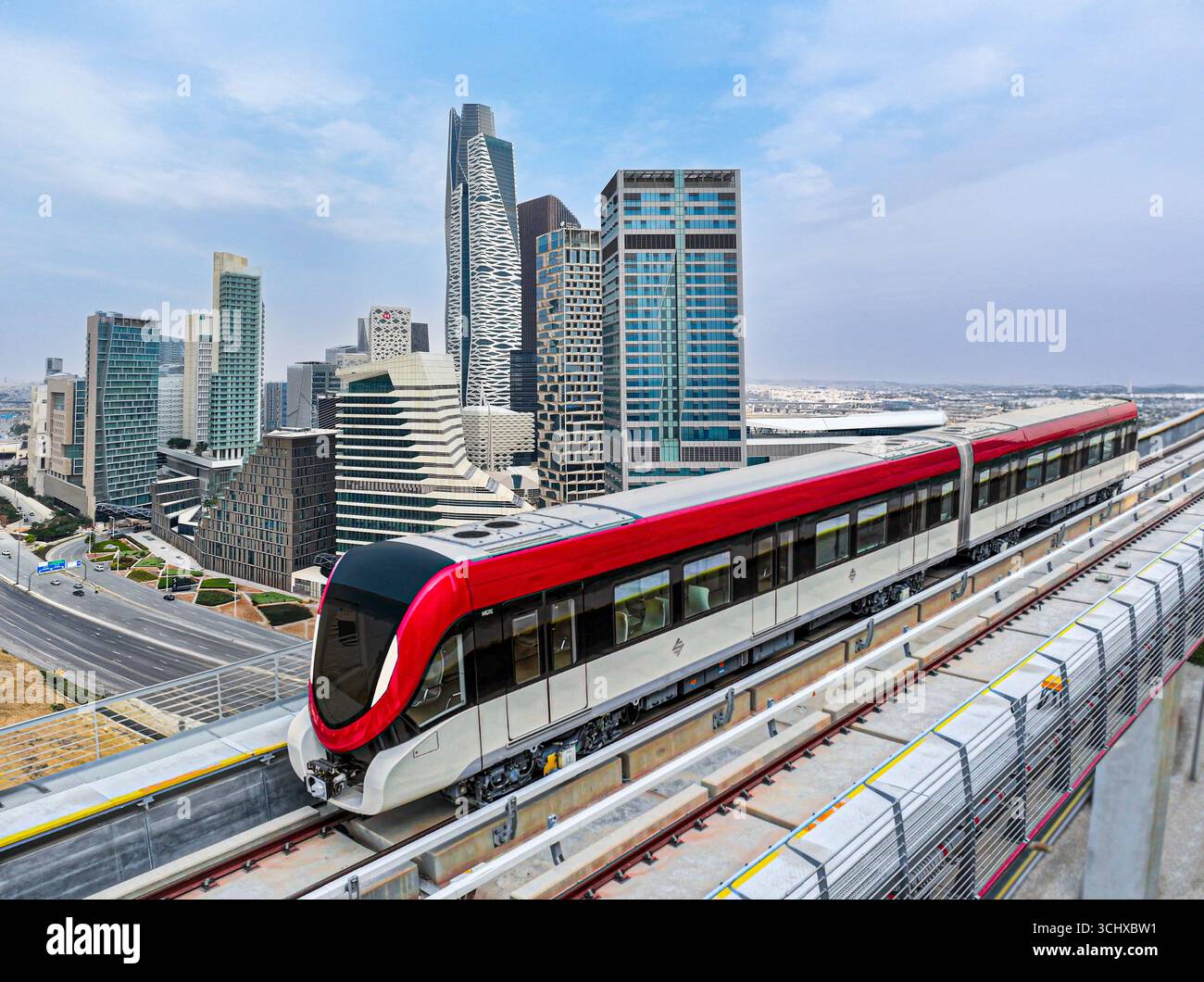 Riyadh Metro Red Line train running on its route with King Abdullah ...