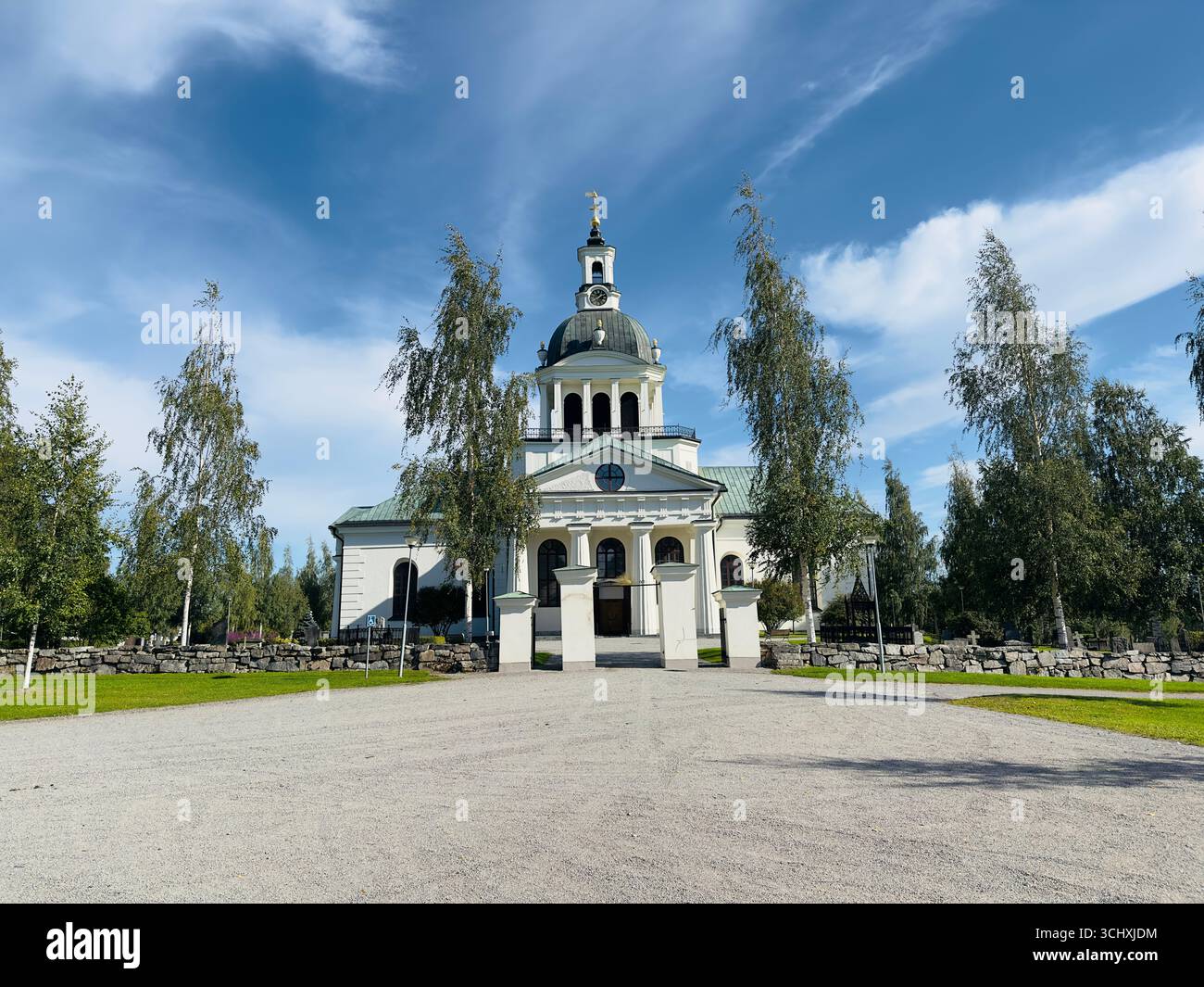 Landskyrkan church in Skellefteå, Sweden under a bright blue sky - Smartphone Captured Stock Image