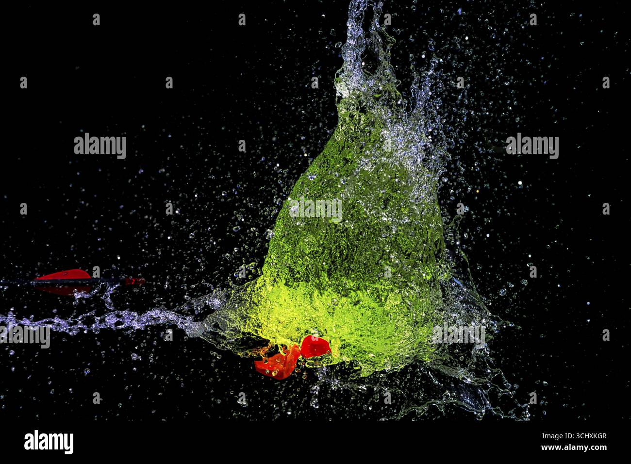 Baloon Splash A green water balloon bursts and creates a dynamic water splash scene ...