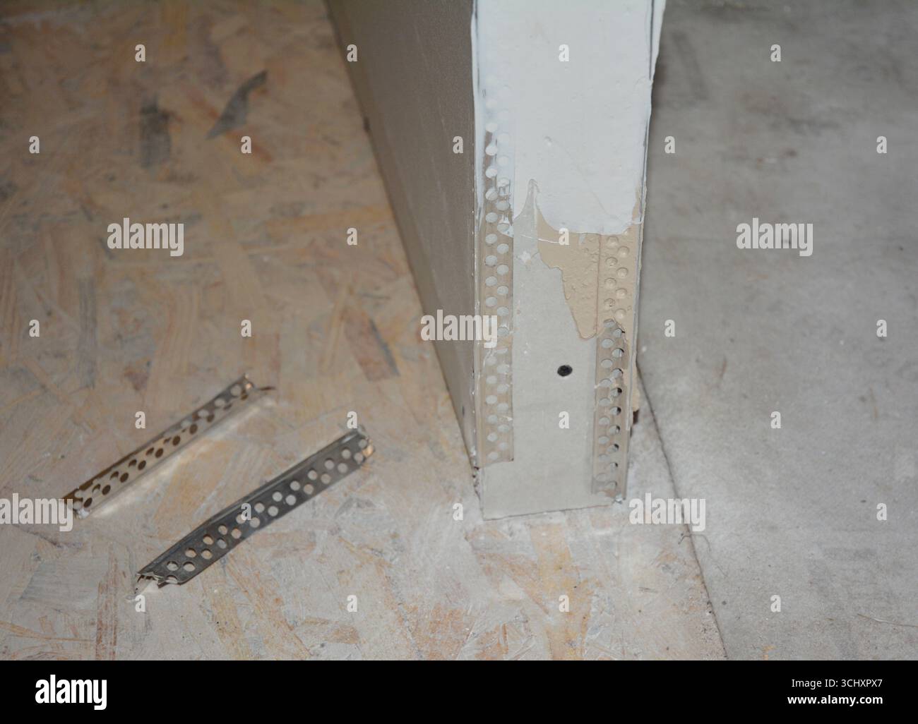 Close up on metal external corner to finish off your drywall or plasterboard installation. Drywall Cornerbead. Stock Photo