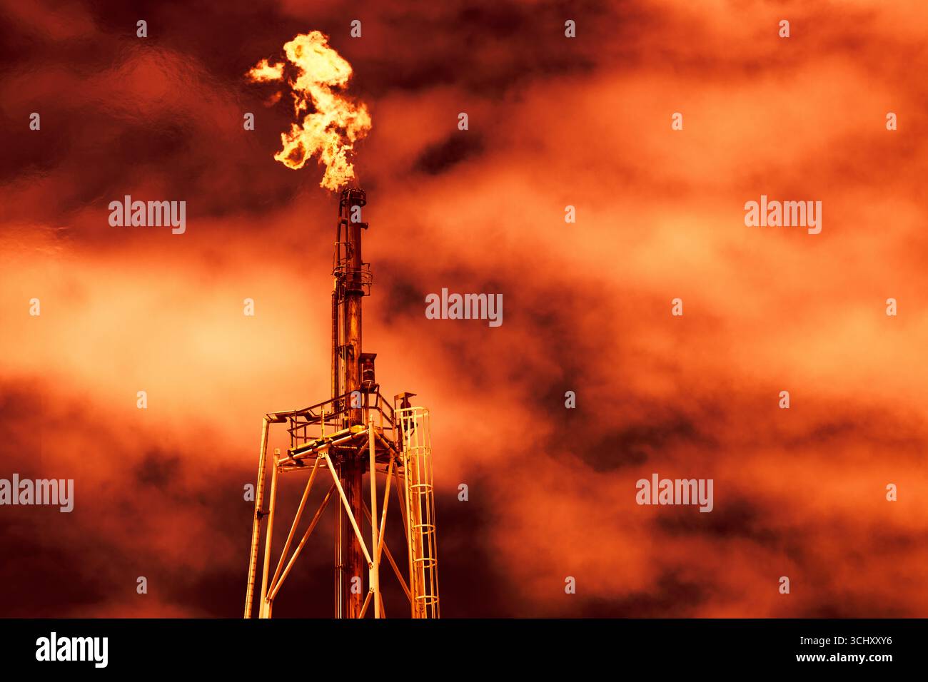 Flare Tower, Methane Gas flare red smoke for Global warming impact from gas burning petroleum industry Stock Photo