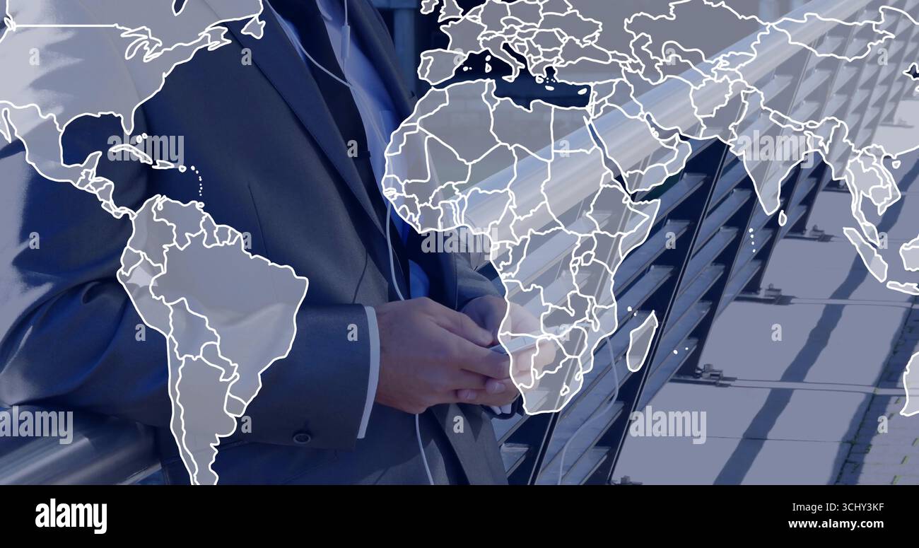 Standing man in dark suit clasping hands on rooftop terrace, with glass railing and map overlay Stock Photo