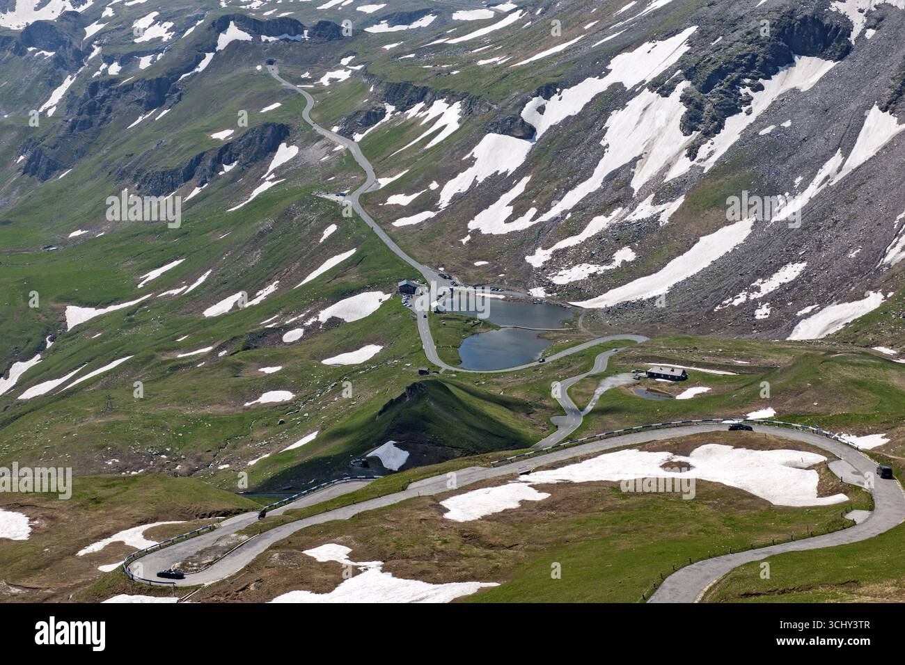 View from Edelweiss ridge to mountain pass Alpine pass Alpine mountain road Alpine road Pass road Pass road Pass old Grossglockner High Alpine Road Gr Stock Photo