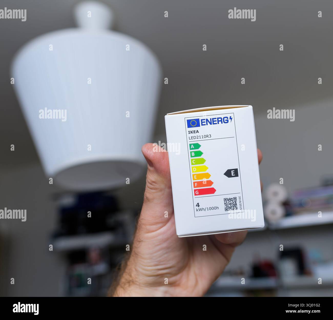 Paris, France - May 21, 2024: Hand holding IKEA LED bulb package ...