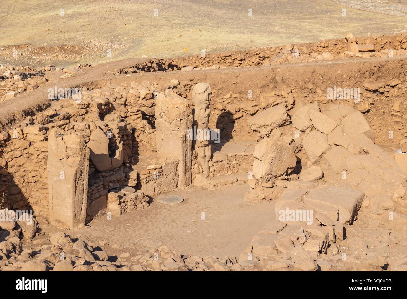 Karahantepe archaeological site with steles and anthropomorphic statue. Pre-Pottery Neolithic archaeological site in Sanliurfa Turkey. Stock Photo