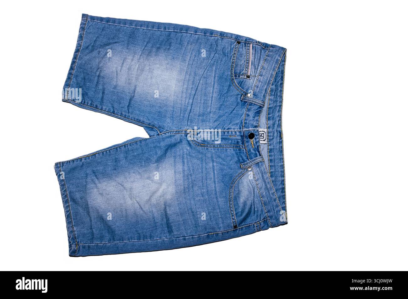 Blue denim shorts on a white background. Stock Photo