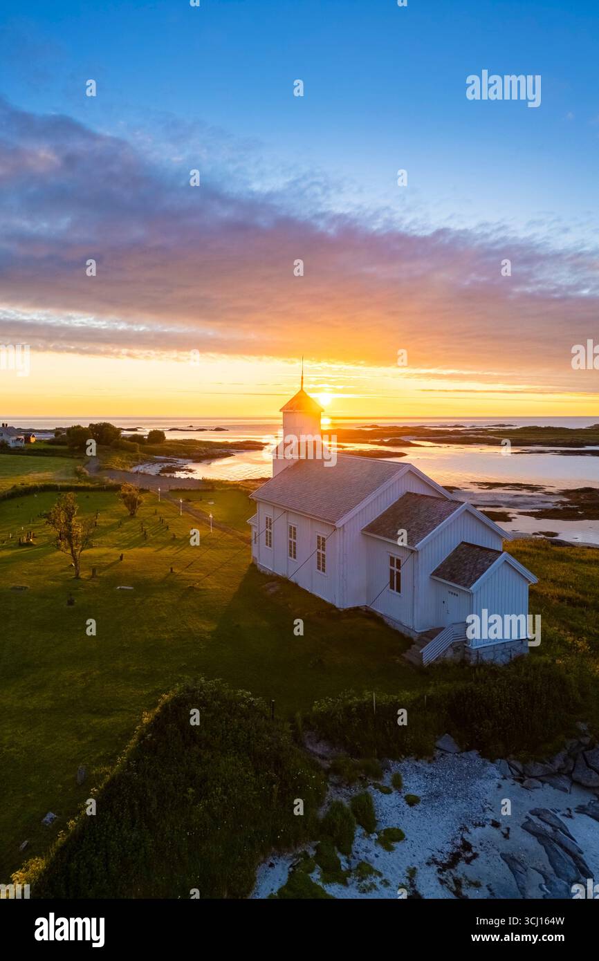 View of the Gimsoy church at sunset during midnight sun in summer. Austvagoya, Gimsoya, Vagan Municipality, Nordland county, Norway. Stock Photo