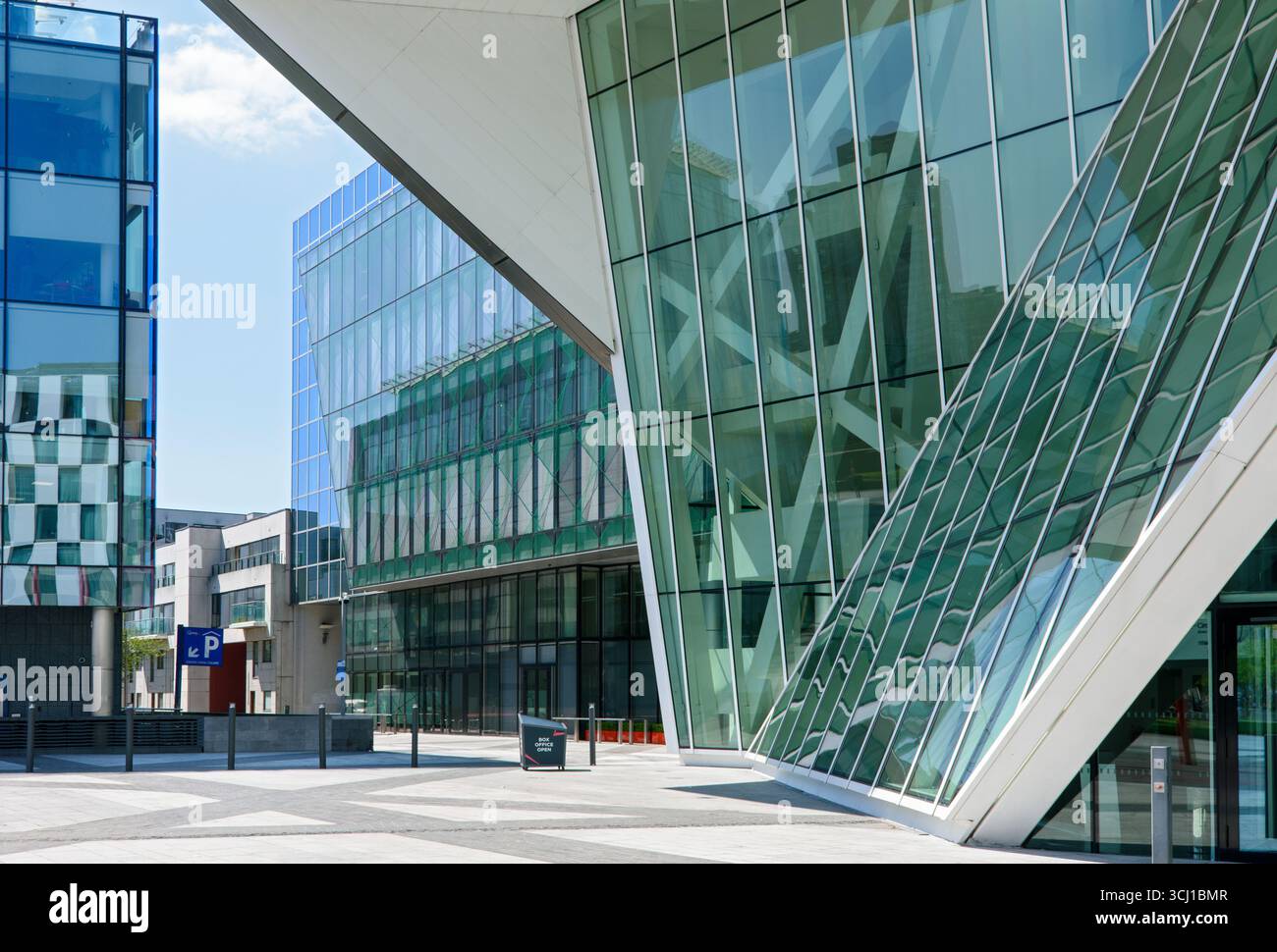 The Bord Gáis Energy Theatre designed by Daniel Libeskind, and the One Grand Canal Square office block, Grand Canal Square, Docklands, Dublin, Ireland Stock Photo