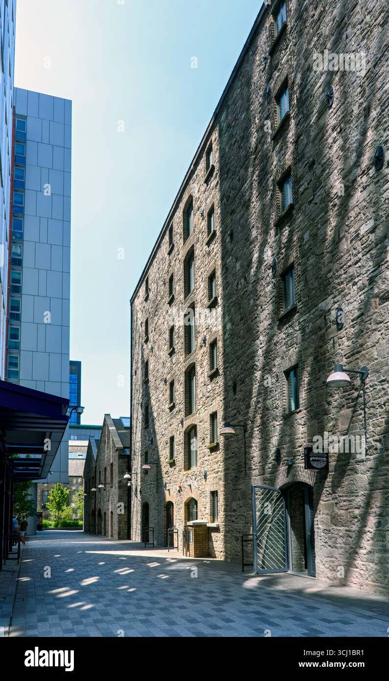 Tower 2 and one of the original flour mills at the Boland's Mills development, Docklands, Dublin, Ireland.  BKD Architects 2022. Stock Photo