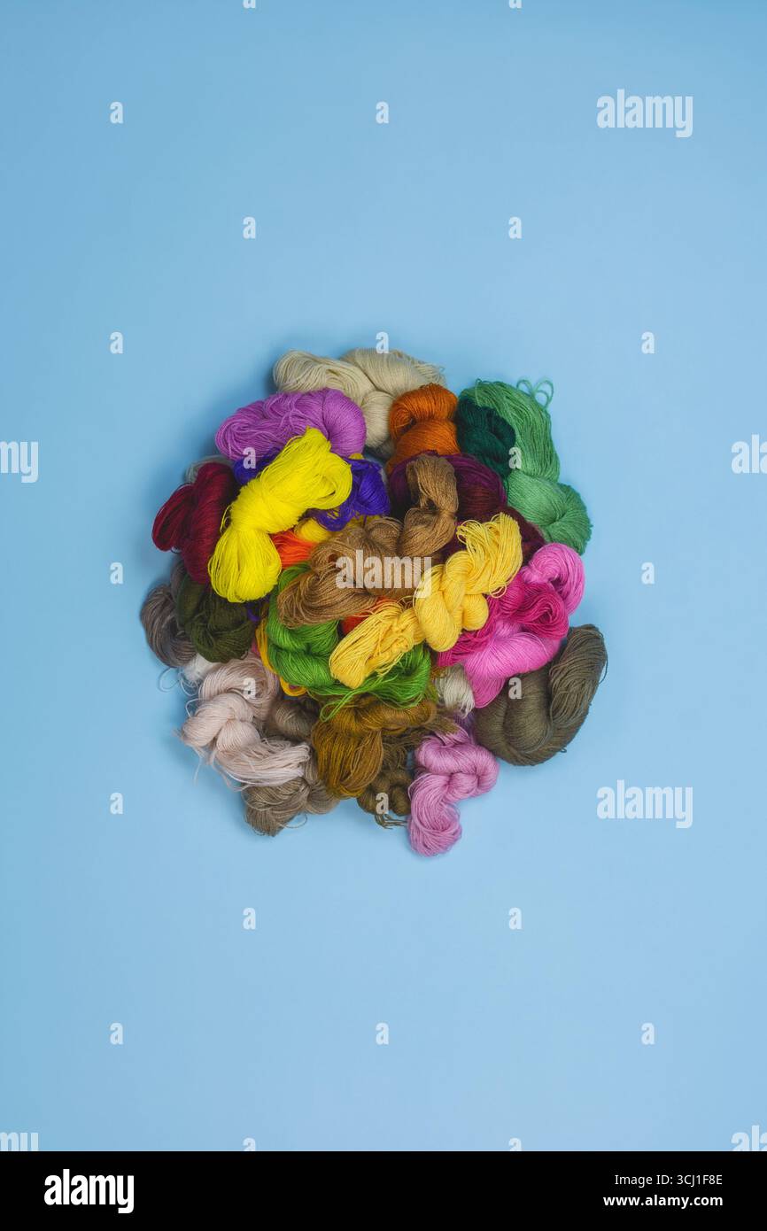 Mouline cotton or silk thread used for embroidery. Multicolored different threads embroidery floss. Many mixed vivid colored sewing threads for embroi Stock Photo