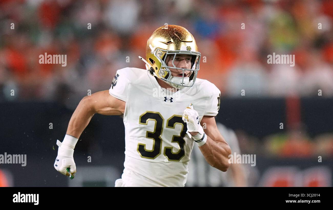 Notre Dame defensive lineman Christopher Burgess Jr. (33) covers a kick ...