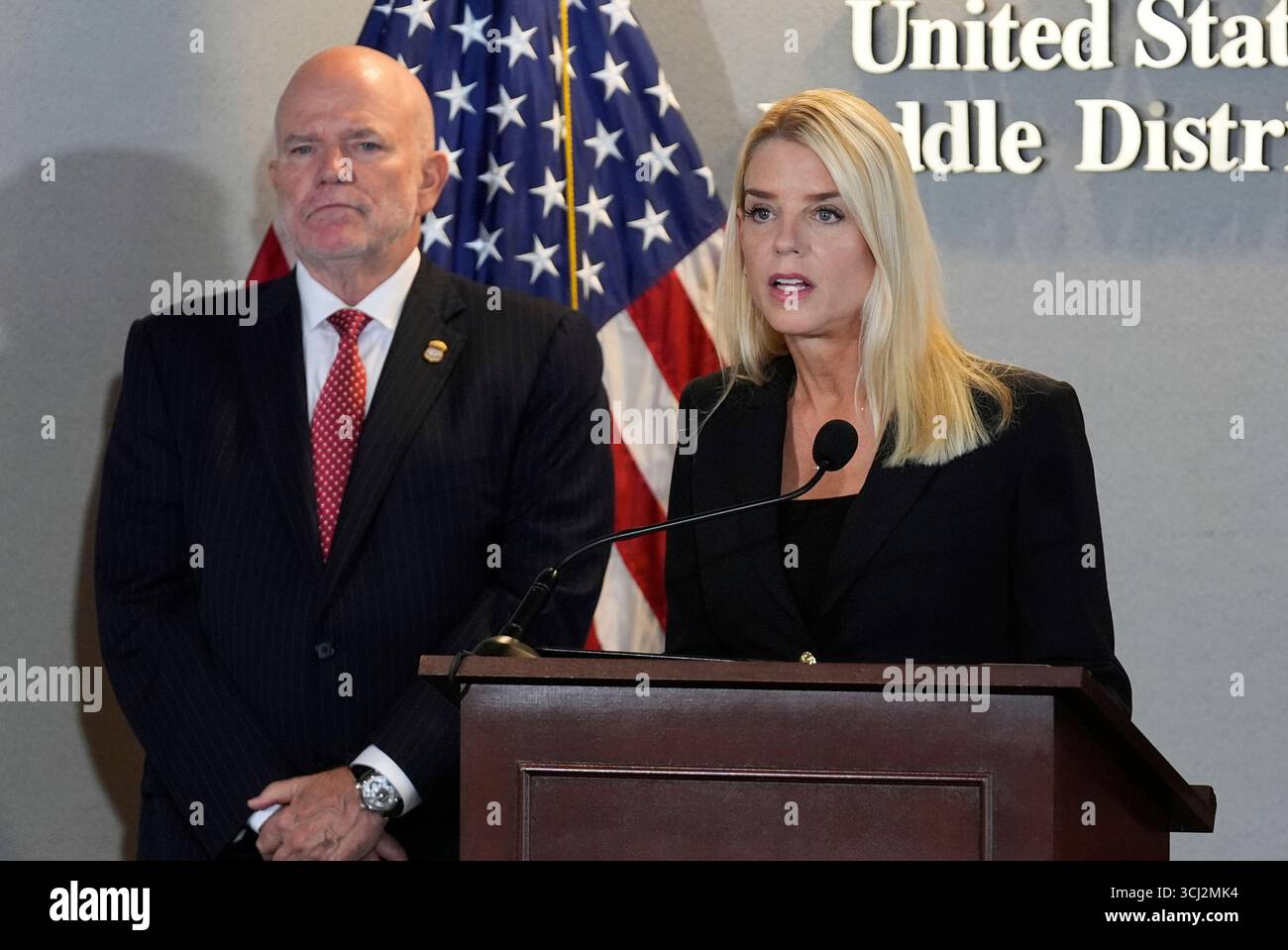 Attorney General Pam Bondi speaks as U.S. Attorney of Middle District ...