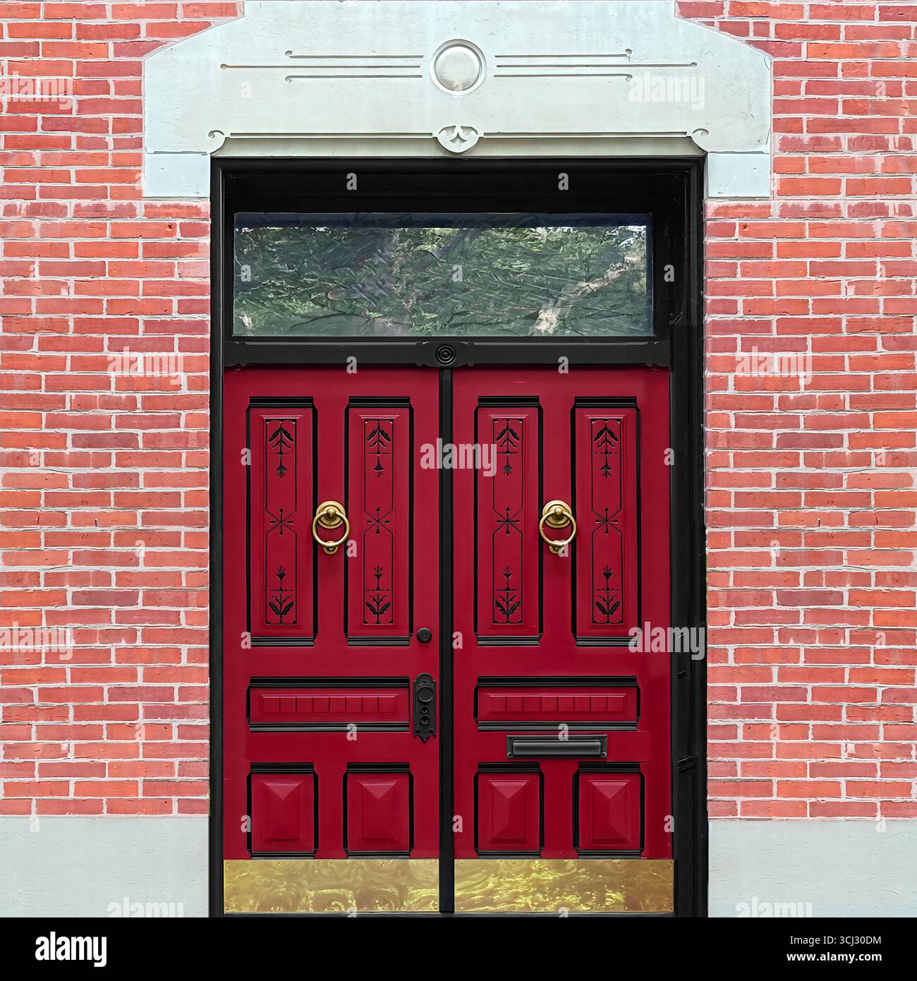 Decorative red double doors with black trim, brass knockers, and carved details on a historic Chicago brick facade. - Smartphone Captured Stock Image
