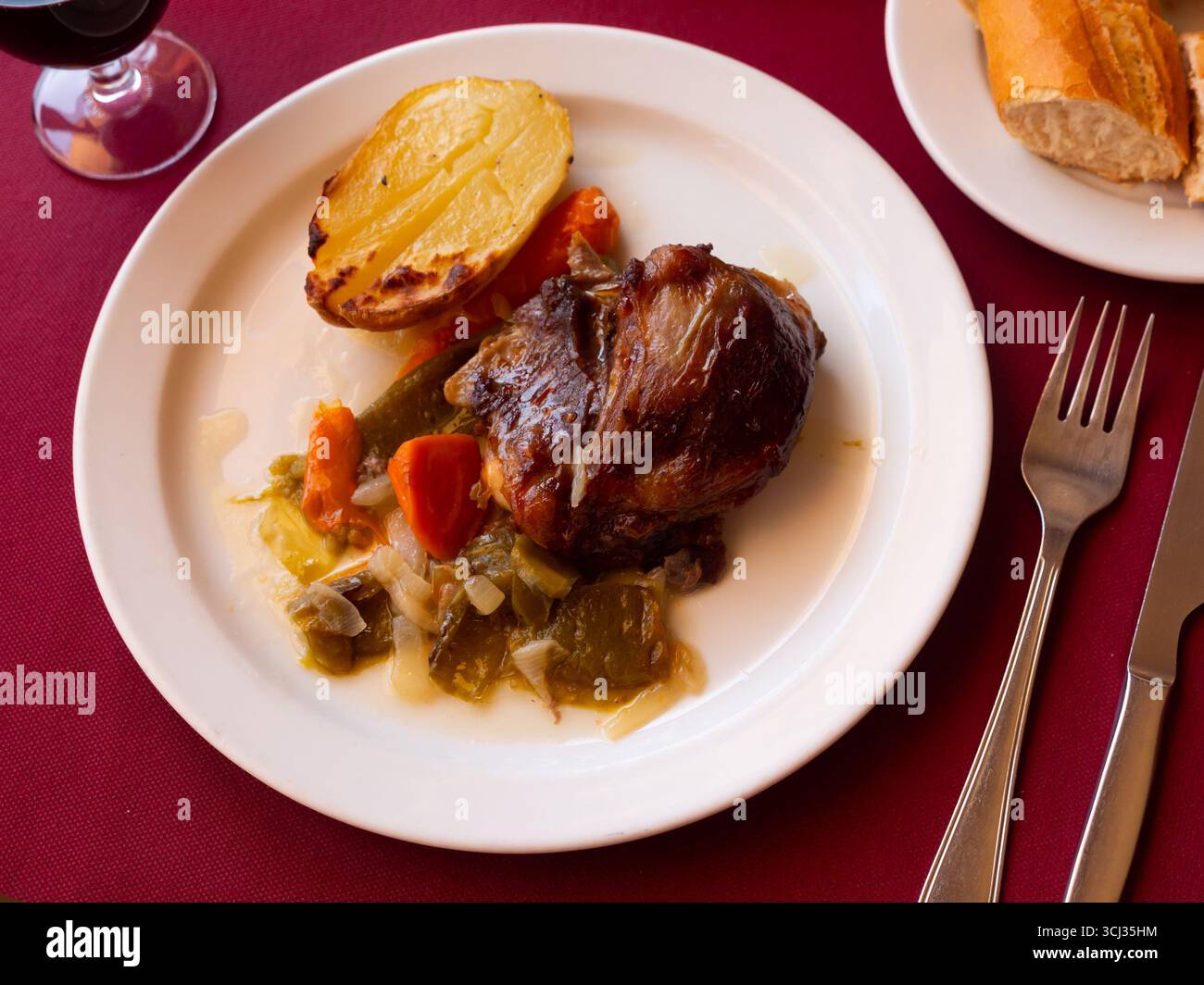 Baked Pork cheeks with potato Stock Photo - Alamy