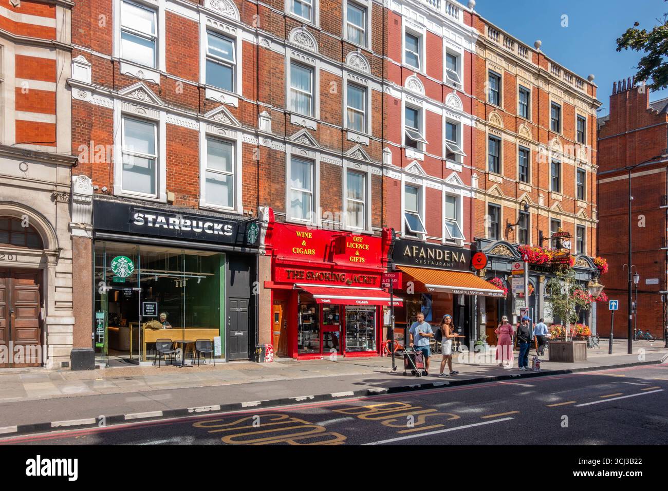 Local shops and businesses on Earl's Court Road in London, UK Stock Photo