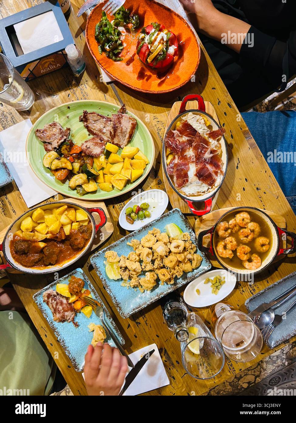 Tapas food plates on a table in Malaga, Spain - Smartphone Captured Stock Image