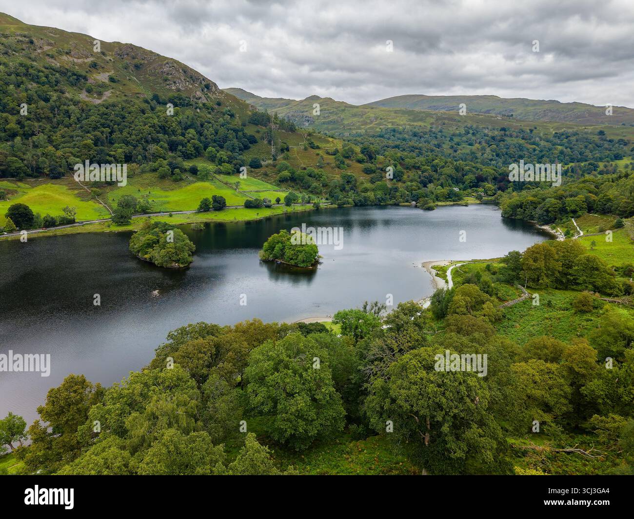 Cloudy summer day over the tranquil Rydal Water in the English Lake District, UK Stock Photo