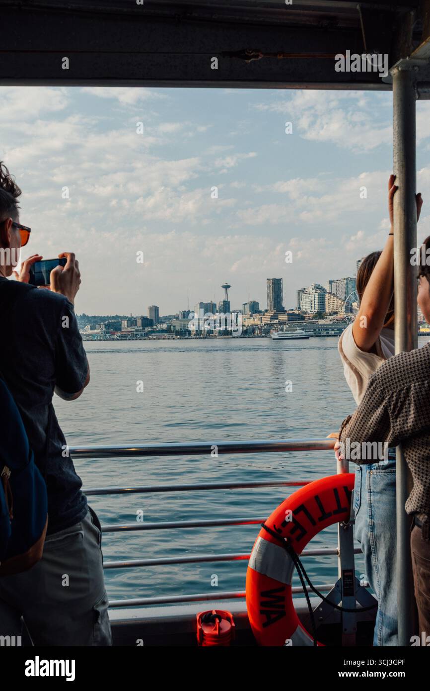 on the water taxi, taking pics of downtown Seattle waterfront Stock Photo