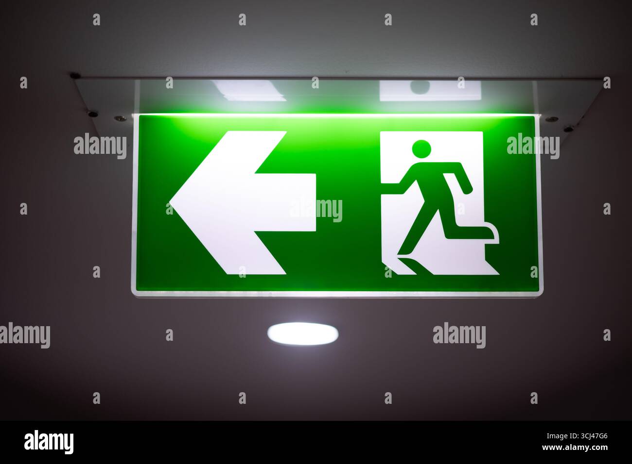 Exit way out arrow direction, Escape guidance sign green color light ...