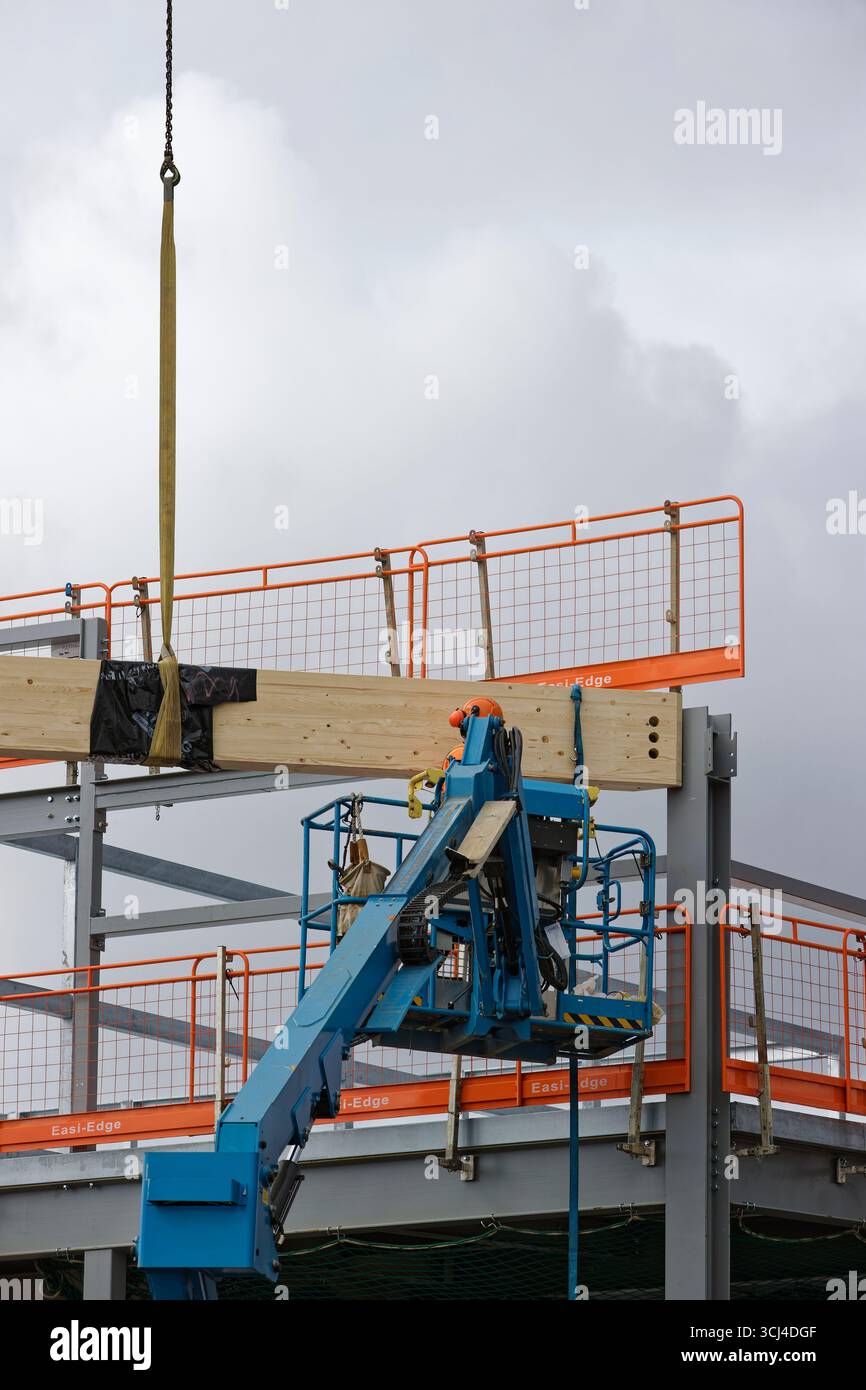 Workman Manchester Glulam laminated timber beam suspended from crane hi-res stock ...