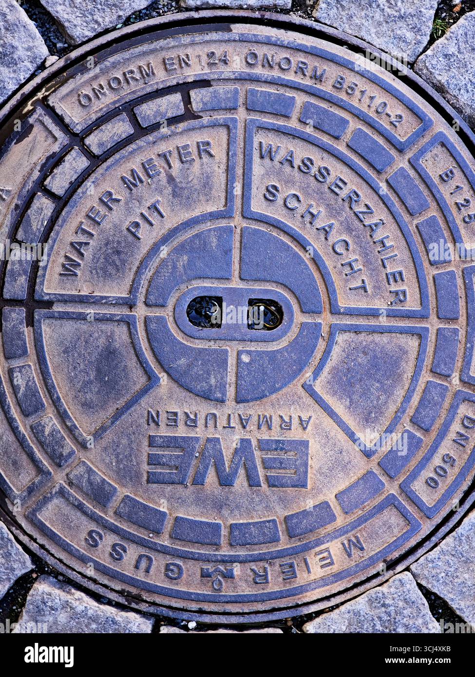 Cover of a water meter pit, water meter pit, city centre, street, round ...