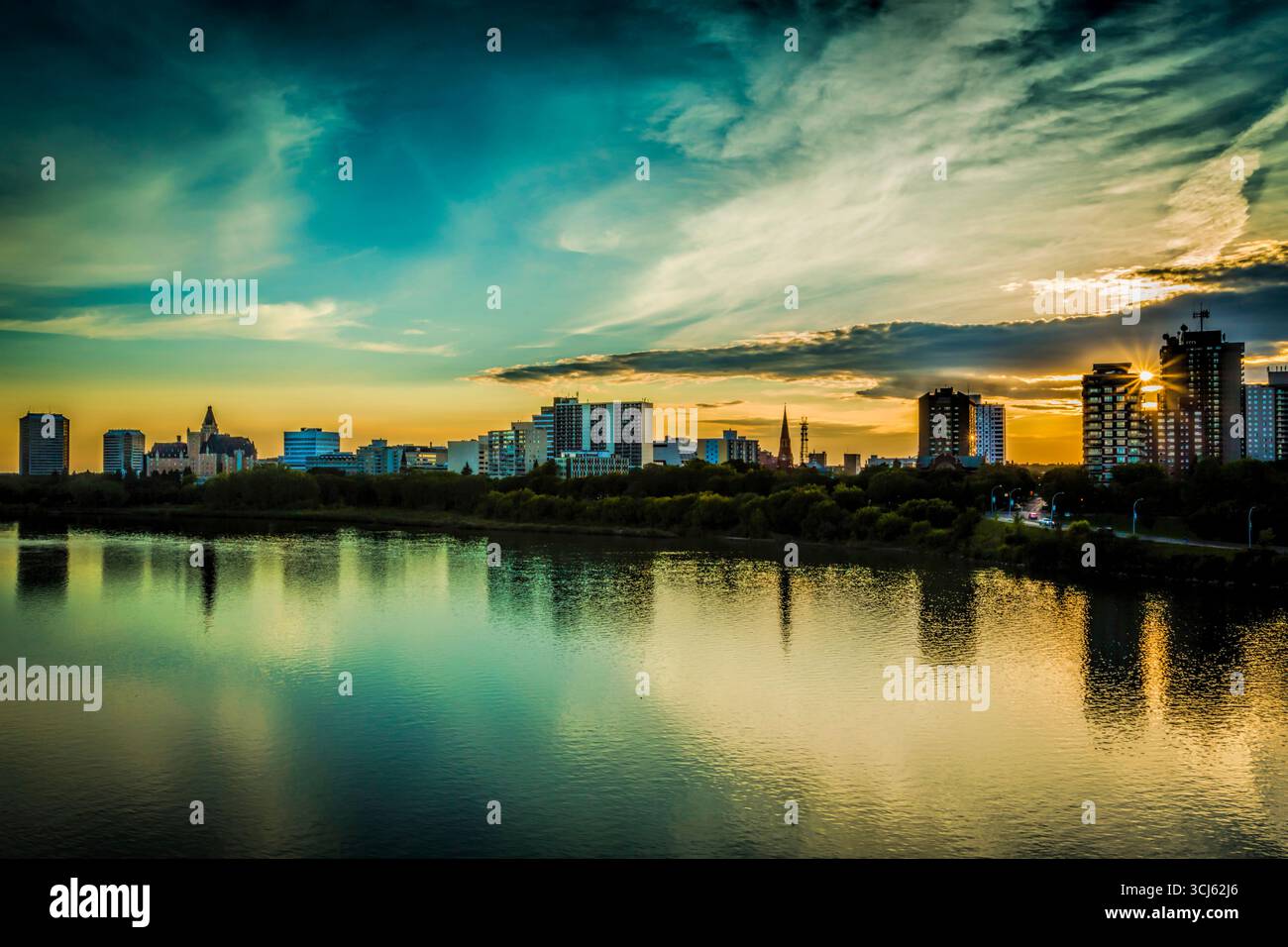 The skyline of Saskatoon, Canada at sunset. Stock Photo
