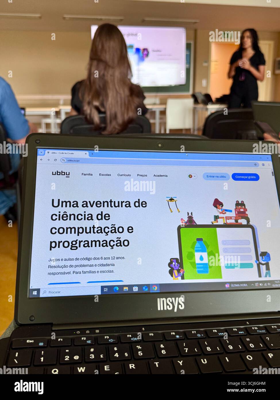 Portuguese teacher training session on computer science and programming with Ubbu platform in a classroom setting. - Smartphone Captured Stock Image