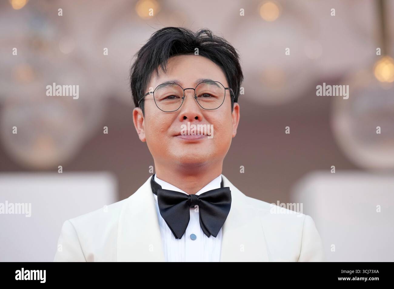 Zhang Songwen poses for photographers on the red carpet for the film ...