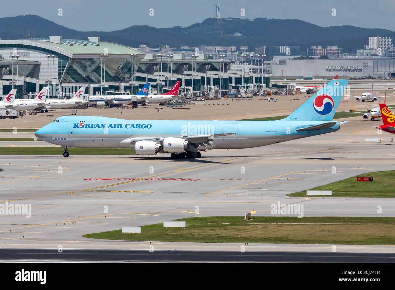 A photograph captures a Korean Air Cargo Boeing 747-8F at Incheon