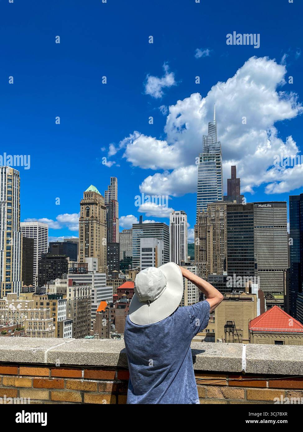 View of Manhattan Midtown skyline from a luxury co-op apartment roof deck in Murray Hill historic district, 2025, New York City, United States - Smartphone Captured Stock Image