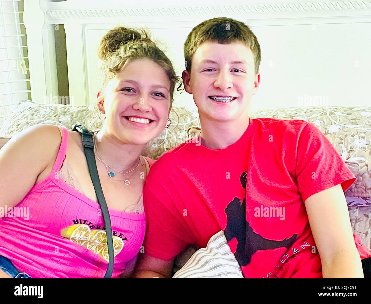 Teenage brother and sister pose for a snapshot, 2025, Great Falls, Montana, United States - Smartphone Captured Stock Image
